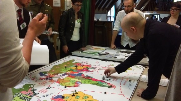 Humans discuss global conflict matters. Discussing global conflict matters requires huge stocks of biscuits, apparently.