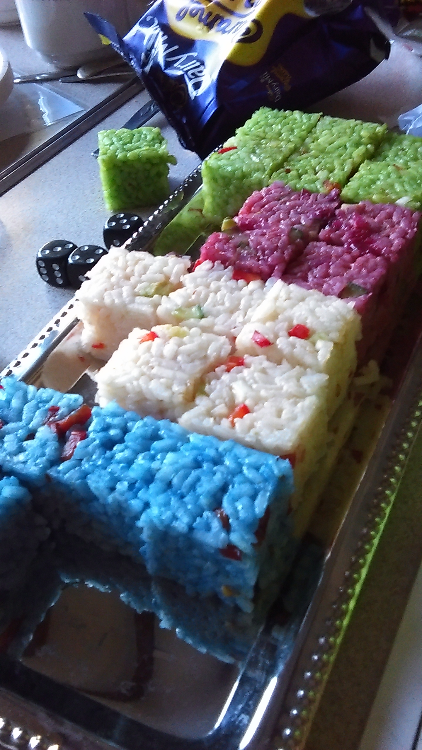 Reticulan food cubes, presented as gifts to the combined Human nations.